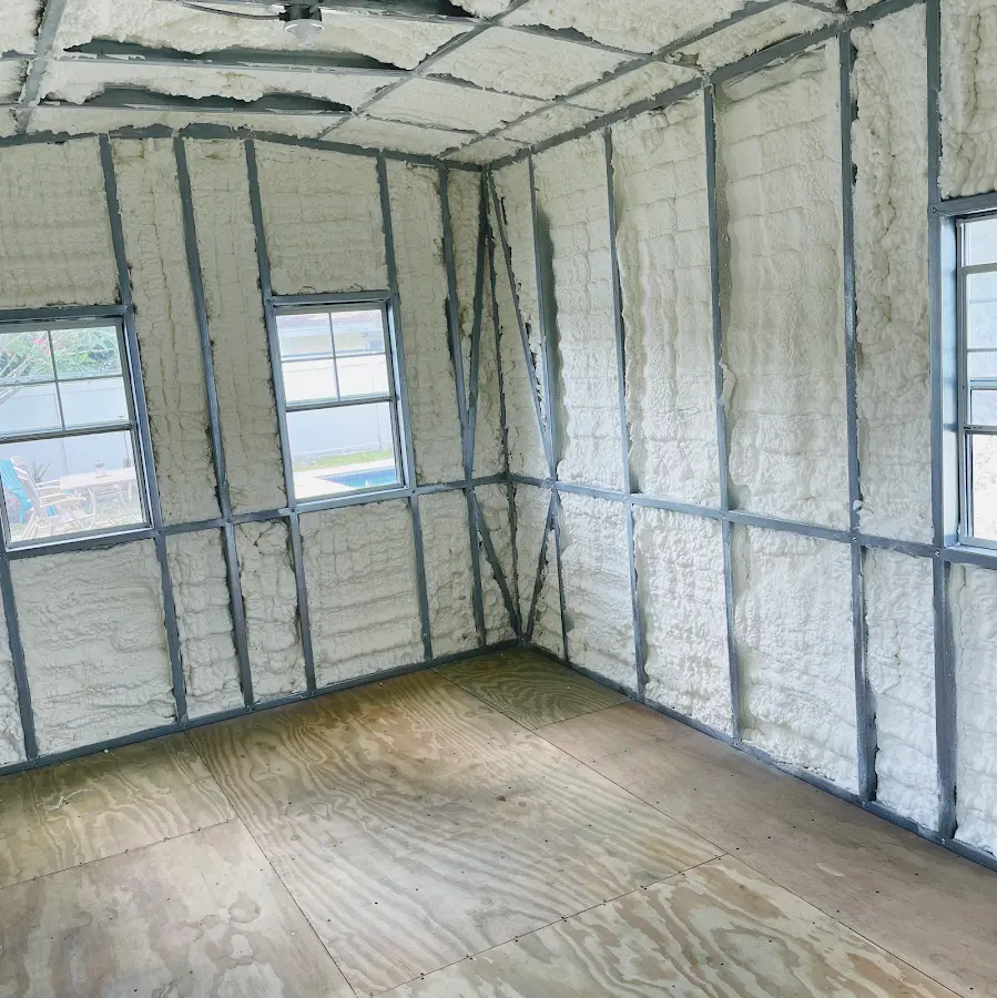 Closed-cell spray foam insulation applied to wall cavities in a residential project in Patterson